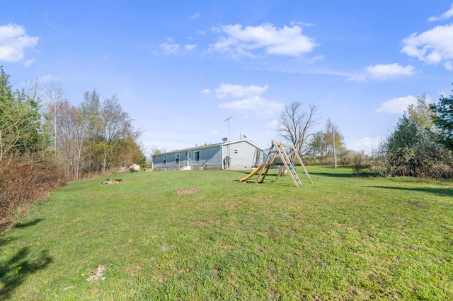 3311 5 Mile Rd, Sears, MI 49679 - view of green lawn with a playground