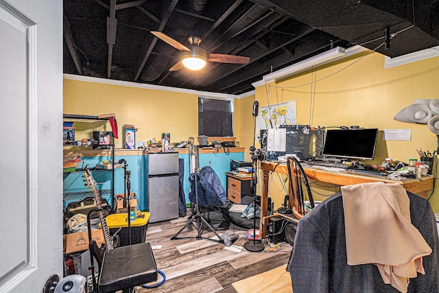 6606 Preston Rd, Howell, MI 48855 - office area featuring wood finished floors, ceiling fan, and ornamental molding