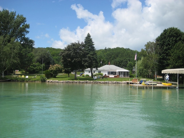 12225 SW Torch Lake Dr SW, Rapid City, MI 49676 - water view with a forest