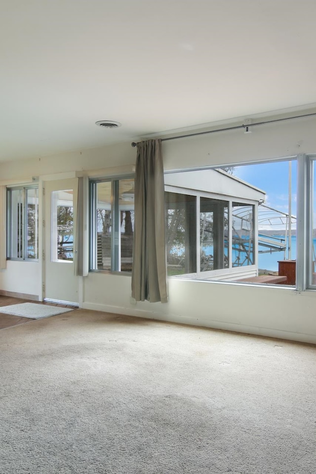12225 SW Torch Lake Dr SW, Rapid City, MI 49676 - carpeted spare room with plenty of natural light