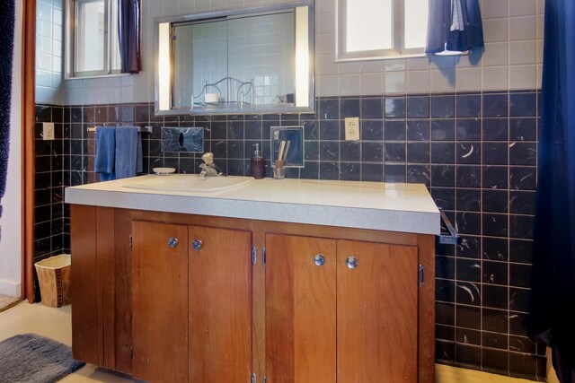 12225 SW Torch Lake Dr SW, Rapid City, MI 49676 - bathroom with vanity and plenty of natural light