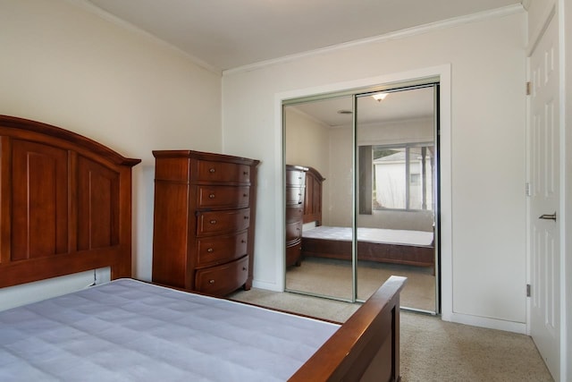 12225 SW Torch Lake Dr SW, Rapid City, MI 49676 - bedroom featuring ornamental molding, a closet, and light carpet