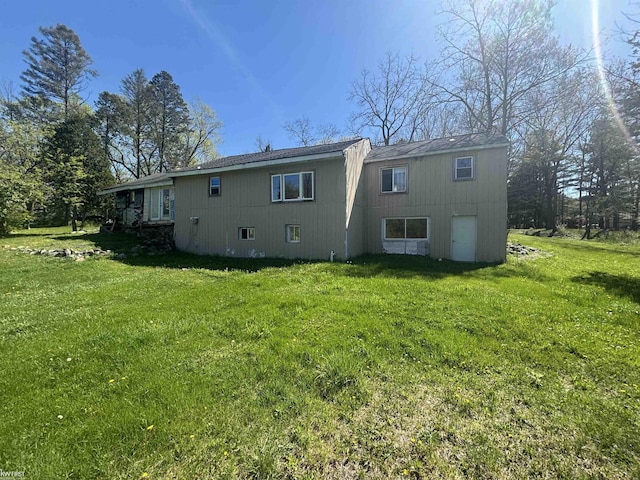 7415 Linden Rd, Fenton, MI 48430 - back of house with a lawn