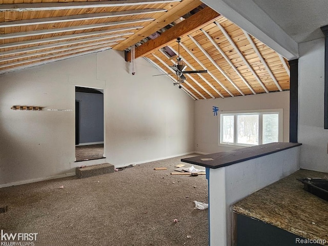7415 Linden Rd, Fenton, MI 48430 - unfurnished living room with baseboards, carpet floors, and wooden ceiling
