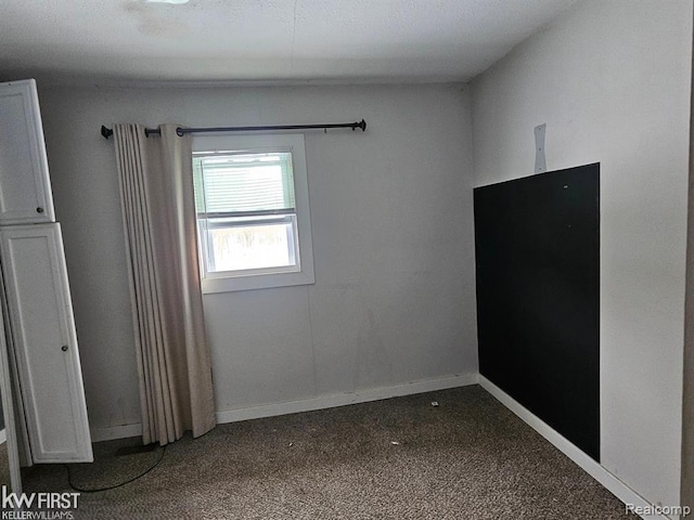 7415 Linden Rd, Fenton, MI 48430 - unfurnished room with dark carpet
