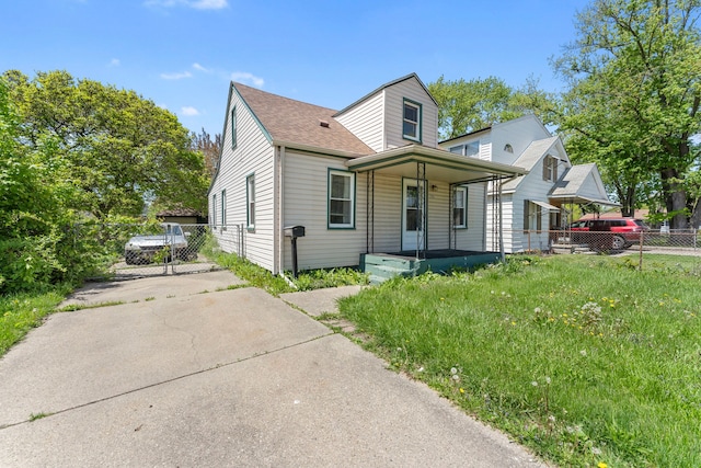 view of front of property with a porch, fence, and roof with shingles