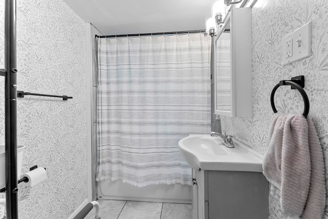 bathroom with vanity, tile patterned floors, shower / bathtub combination with curtain, and wallpapered walls