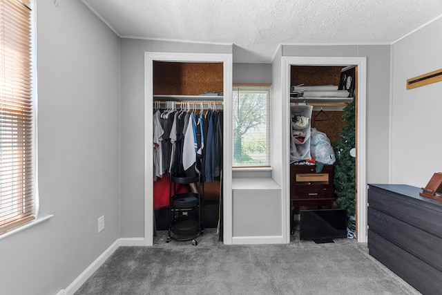 bedroom with carpet and a textured ceiling