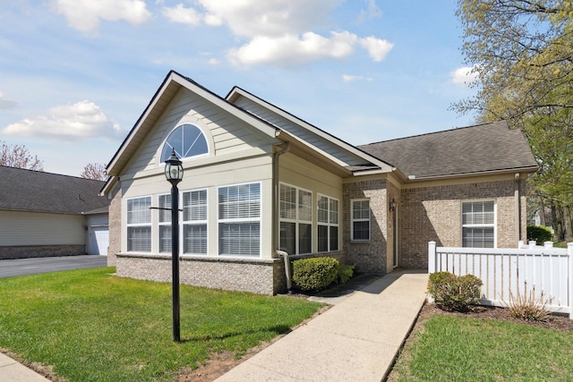 36160 Abbey Dr, Westland, MI 48185 - view of front of house with brick siding and a shingled roof