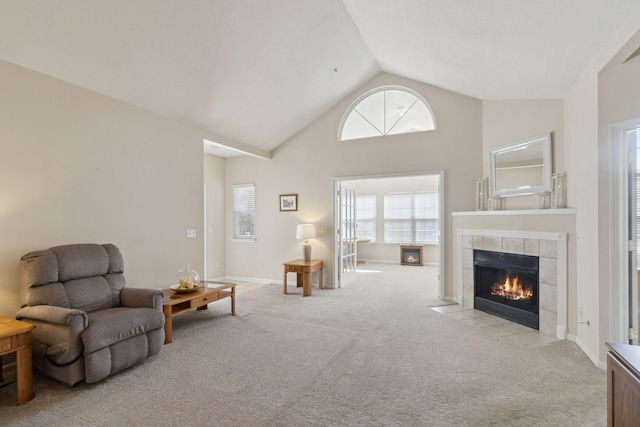 36160 Abbey Dr, Westland, MI 48185 - living area with light colored carpet, a tile fireplace, and high vaulted ceiling