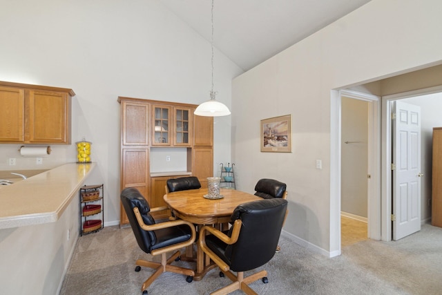 36160 Abbey Dr, Westland, MI 48185 - dining space featuring high vaulted ceiling, light carpet, and baseboards