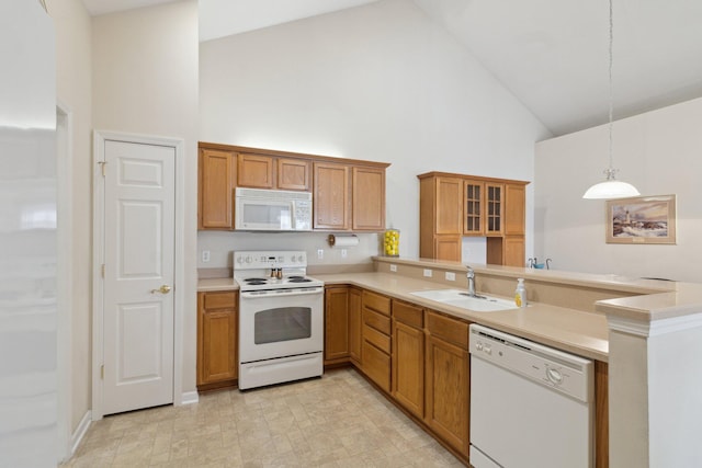 36160 Abbey Dr, Westland, MI 48185 - kitchen featuring white appliances, high vaulted ceiling, a sink, a peninsula, and brown cabinetry