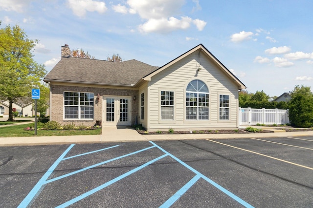 36160 Abbey Dr, Westland, MI 48185 - view of building exterior featuring uncovered parking and fence