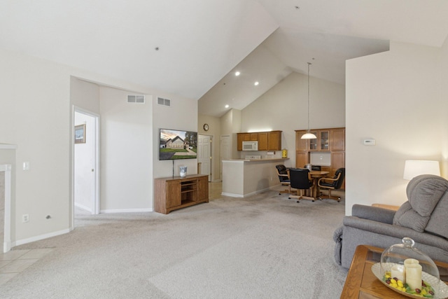 36160 Abbey Dr, Westland, MI 48185 - living area featuring high vaulted ceiling, light carpet, and baseboards
