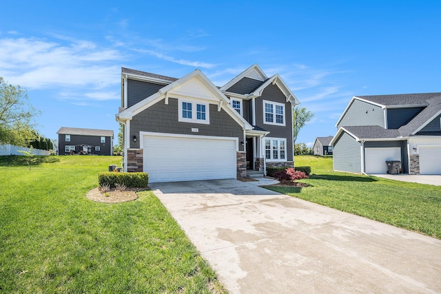 craftsman inspired home with concrete driveway, stone siding, and a front lawn