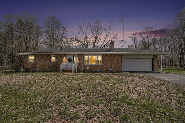 50427 M 51 N, Dowagiac, MI 49047 - ranch-style house featuring a chimney, driveway, an attached garage, and brick siding