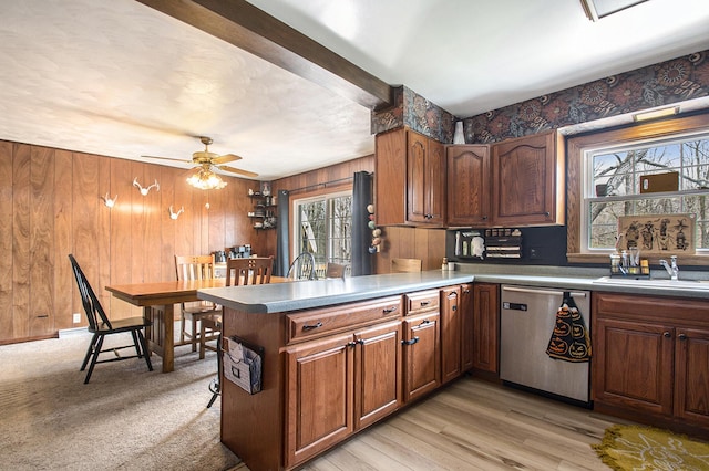 50427 M 51 N, Dowagiac, MI 49047 - kitchen with stainless steel dishwasher, a sink, wood walls, ceiling fan, and brown cabinetry