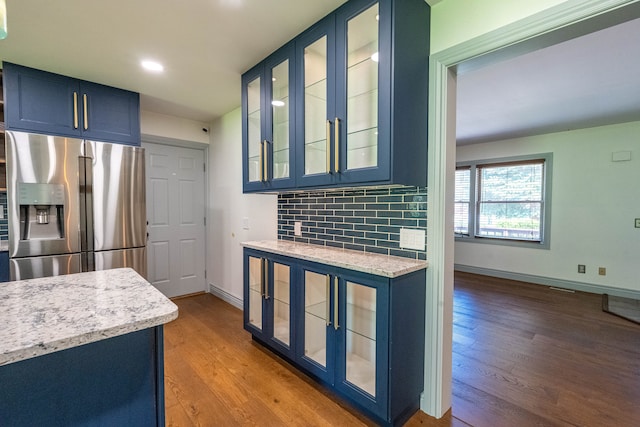 3484 Lakeshore Dr, Monroe, MI 48162 - kitchen featuring stainless steel refrigerator with ice dispenser, blue cabinetry, wood finished floors, baseboards, and recessed lighting
