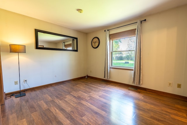 3484 Lakeshore Dr, Monroe, MI 48162 - empty room featuring wood finished floors, a smoke detector, and baseboards