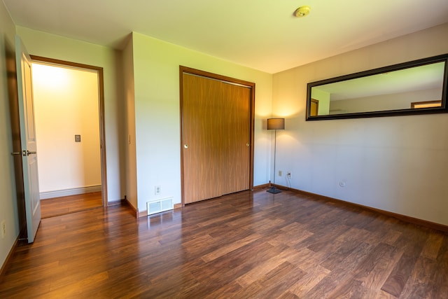 3484 Lakeshore Dr, Monroe, MI 48162 - unfurnished bedroom featuring wood finished floors, a closet, and baseboards