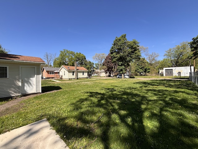 view of yard with a shed and an outbuilding