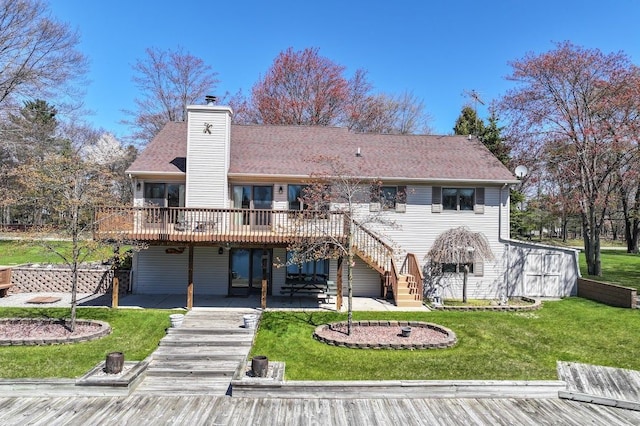 8439 Shoshoni Pass, Pigeon, MI 48755 - back of house with stairway, a wooden deck, a patio area, a lawn, and a chimney