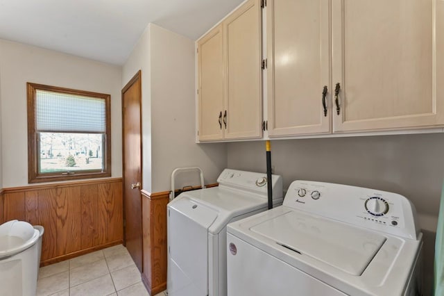 8439 Shoshoni Pass, Pigeon, MI 48755 - laundry area featuring separate washer and dryer, cabinet space, a wainscoted wall, light tile patterned flooring, and wood walls