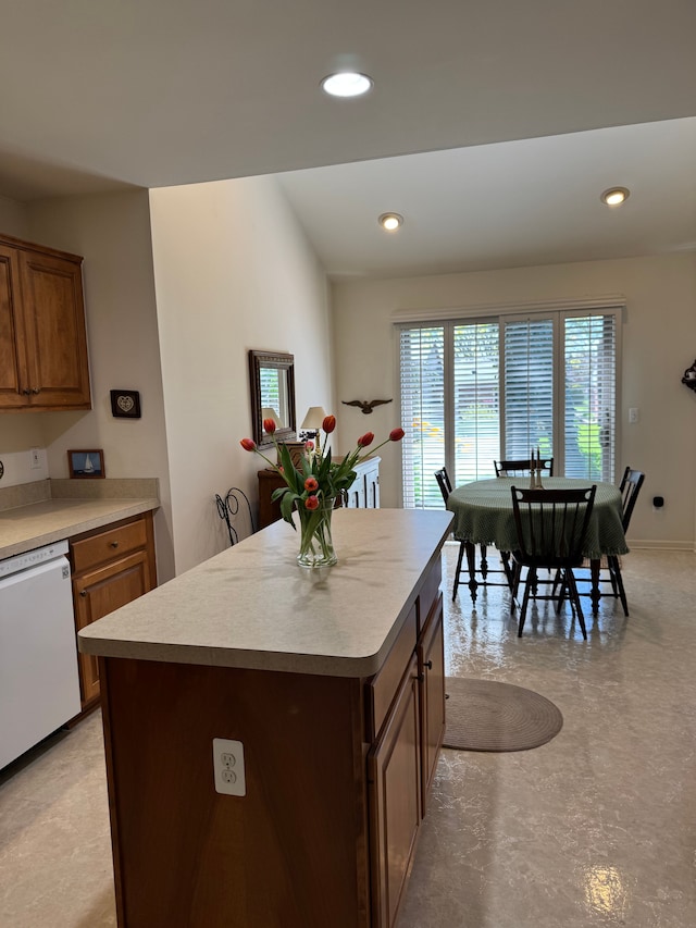 43632 Abbey Cir, Canton, MI 48187 - kitchen with dishwasher, light countertops, a center island, recessed lighting, and concrete flooring
