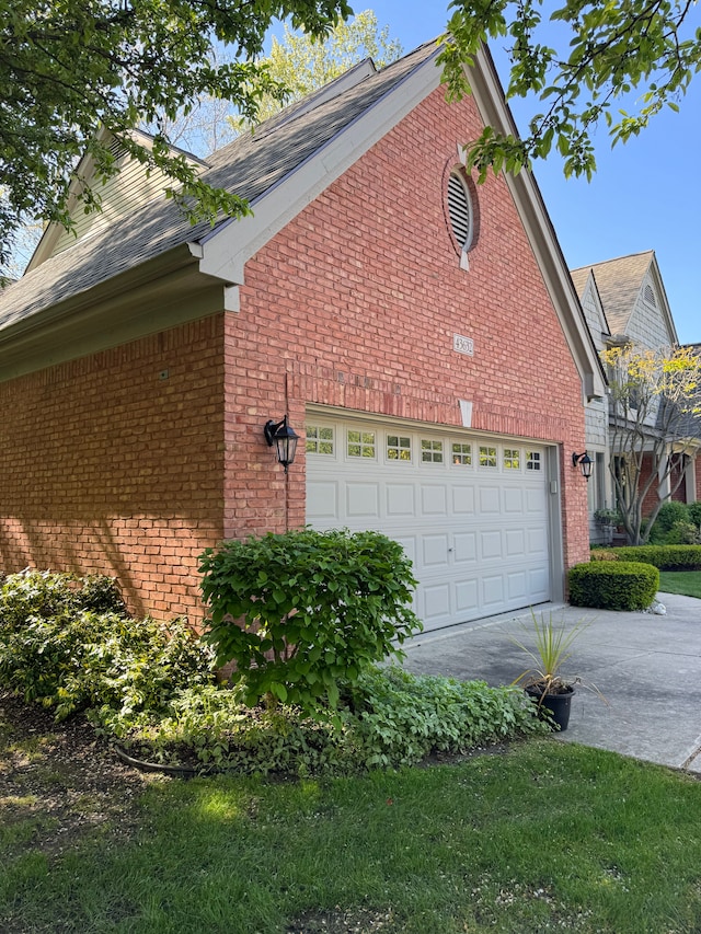 43632 Abbey Cir, Canton, MI 48187 - view of property exterior with brick siding, driveway, and an attached garage