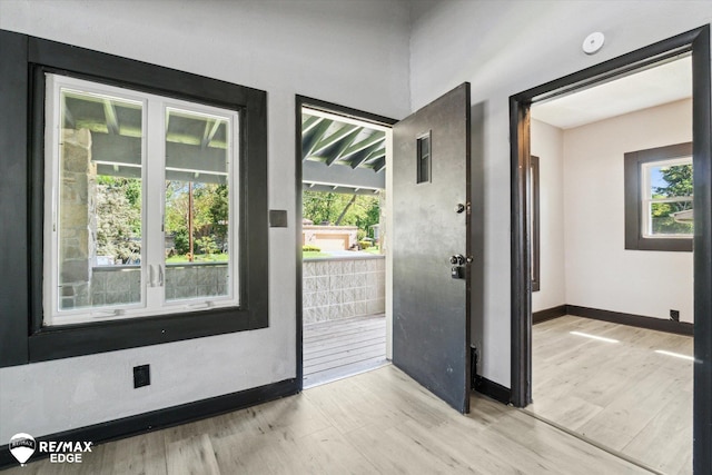 1418 Sunnyside Ave, Flint, MI 48503 - doorway with light wood finished floors and baseboards
