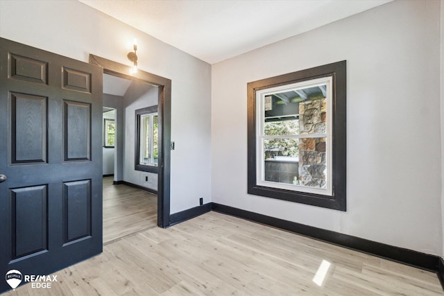 1418 Sunnyside Ave, Flint, MI 48503 - foyer entrance with light wood-type flooring and baseboards