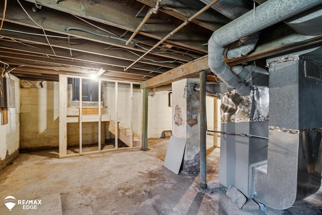 1418 Sunnyside Ave, Flint, MI 48503 - unfinished basement featuring heating unit and stairway