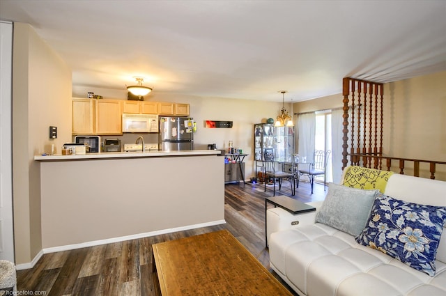 1445 Steeple Chase, Davison, MI 48423 - living room featuring dark wood-style flooring, a chandelier, and baseboards
