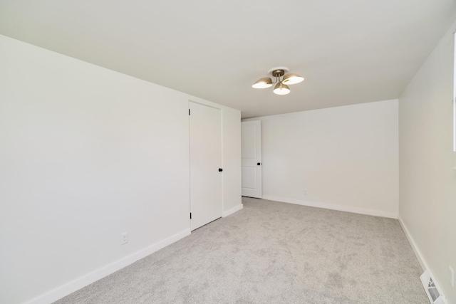923 Maple St, Ludington, MI 49431 - empty room with light carpet and baseboards