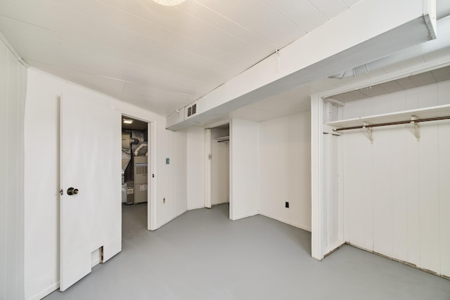 923 Maple St, Ludington, MI 49431 - unfurnished bedroom featuring finished concrete flooring