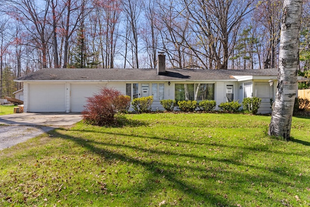 view of front of house featuring a chimney, driveway, a garage, and a front lawn