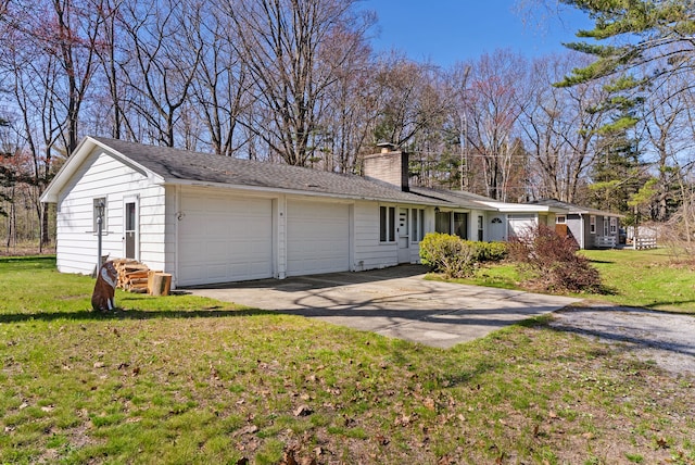 single story home featuring a chimney, an attached garage, and a front lawn