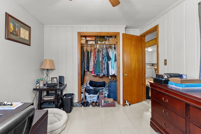 bedroom with crown molding, a closet, and a desk