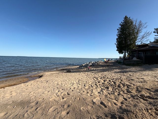 water view with local beach and fence
