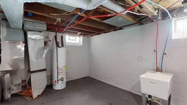 20026 Joann St, Detroit, MI 48205 - below grade area with gas water heater, a sink, and heating unit