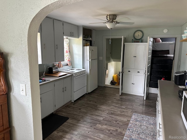 7980 W Gilford Rd, Reese, MI 48757 - kitchen with white appliances, arched walkways, ceiling fan, dark wood finished floors, and light countertops