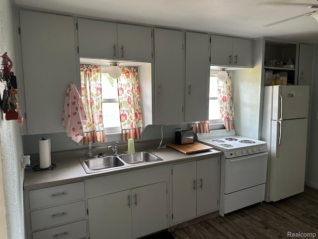 7980 W Gilford Rd, Reese, MI 48757 - kitchen featuring white appliances, dark wood finished floors, and light countertops
