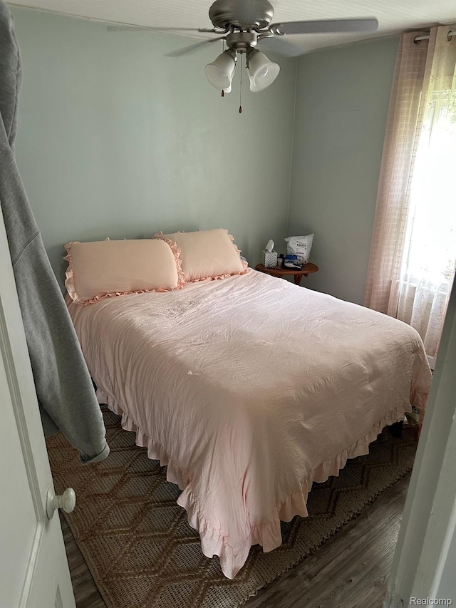 7980 W Gilford Rd, Reese, MI 48757 - bedroom featuring wood finished floors and a ceiling fan
