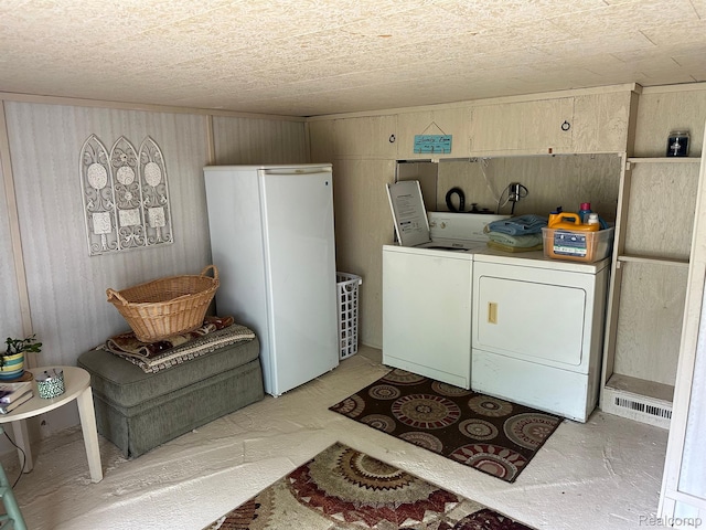 7980 W Gilford Rd, Reese, MI 48757 - laundry room featuring washer and clothes dryer and wood walls