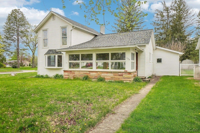 126 Litchfield St, Clinton, MI 49236 - rear view of property with roof with shingles and a chimney
