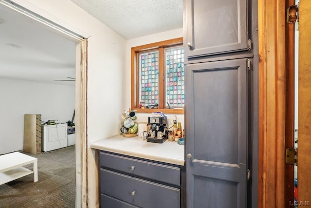 126 Litchfield St, Clinton, MI 49236 - kitchen with gray cabinetry, a textured ceiling, and light countertops
