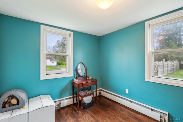 126 Litchfield St, Clinton, MI 49236 - living area featuring baseboard heating and wood finished floors