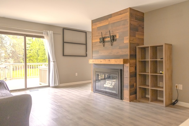 726 Hamilton, Rochester Hills, MI 48307 - unfurnished living room featuring baseboards, wood finished floors, and a fireplace