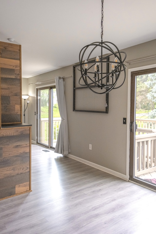 726 Hamilton, Rochester Hills, MI 48307 - unfurnished dining area with a chandelier, wood finished floors, and baseboards