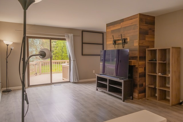 726 Hamilton, Rochester Hills, MI 48307 - unfurnished living room with wood finished floors and baseboards